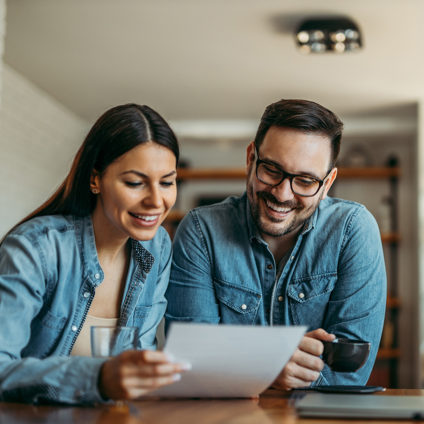 Couple looking at financial document